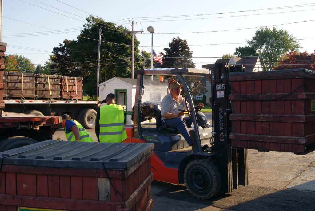 Fork lift operator moving one ton bin of grapes to the dumping station at AgriAmerica Juice processing facility